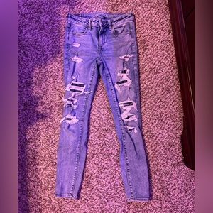 Ripped (with patches) American Eagle skinny jeans